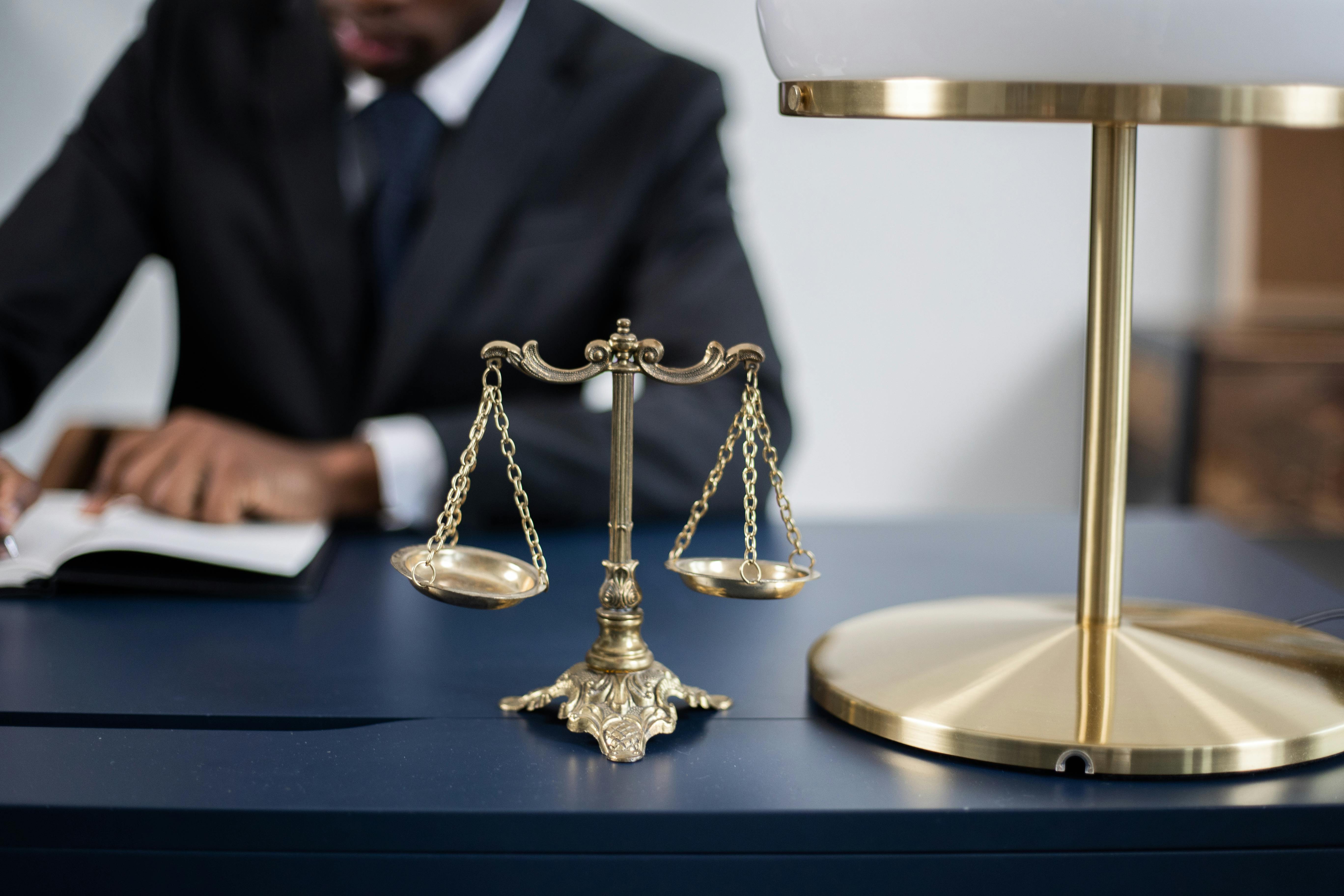 Two business partners confidently reviewing a contract with their corporate law attorney.